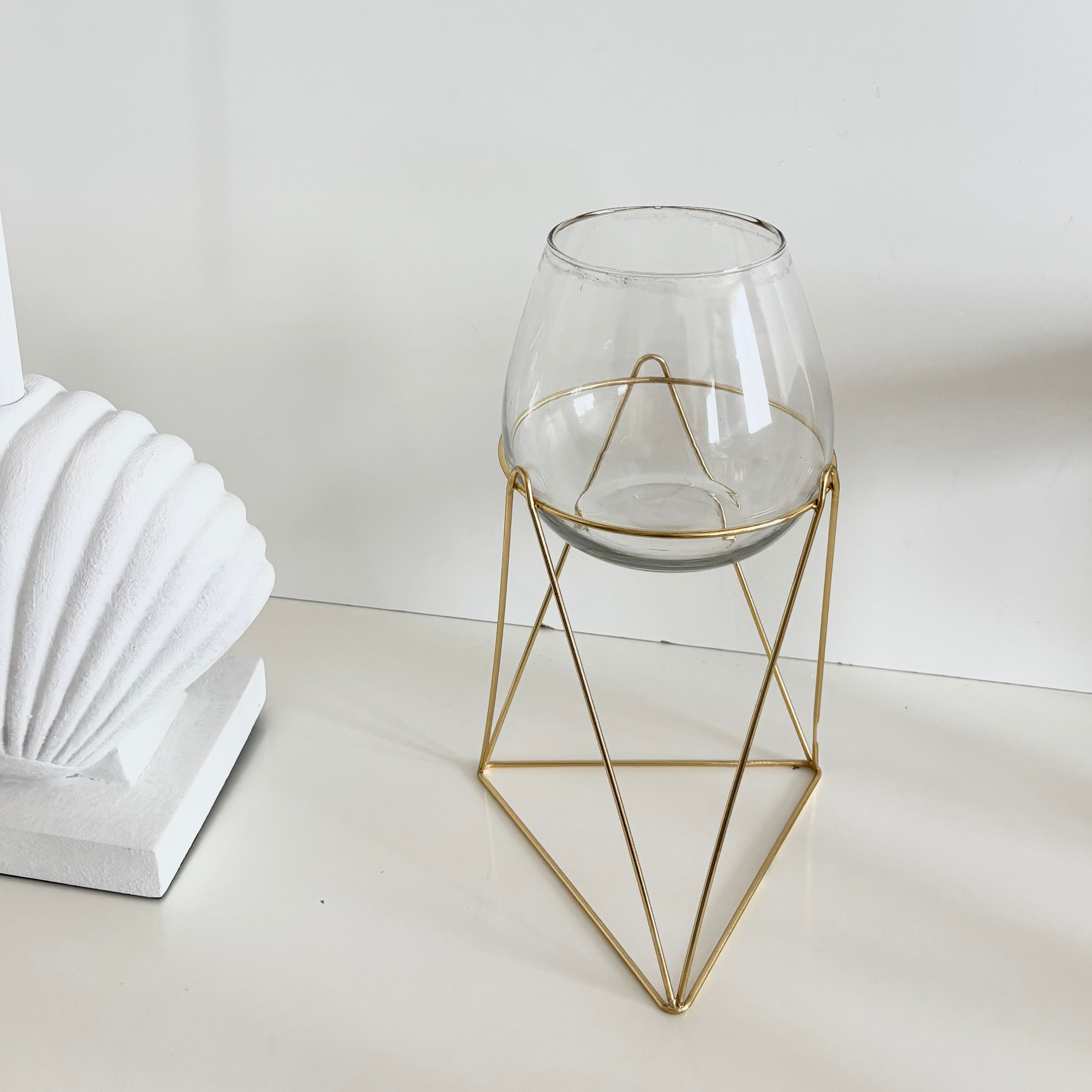 in bloom stand glass vase