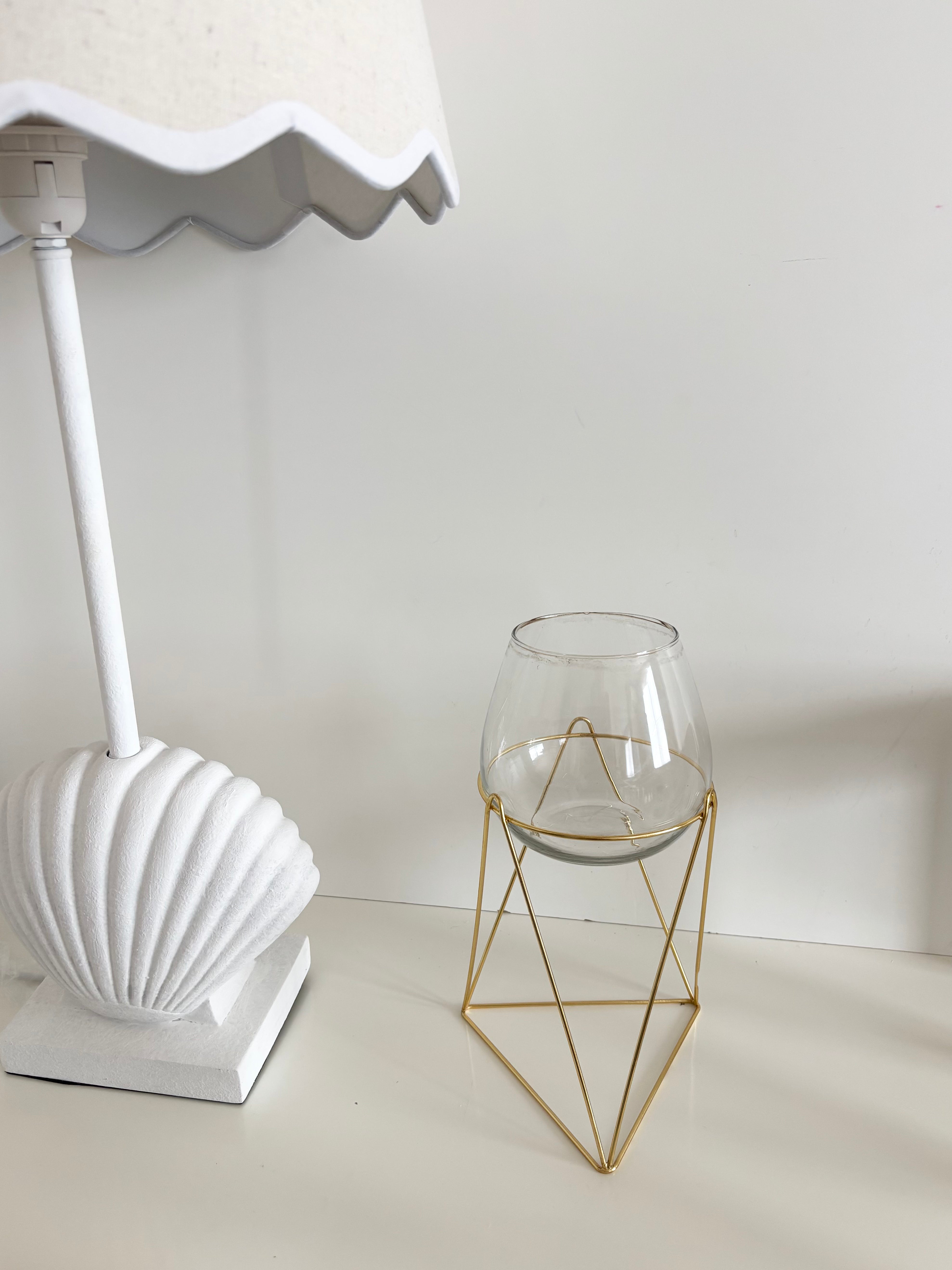 in bloom stand glass vase