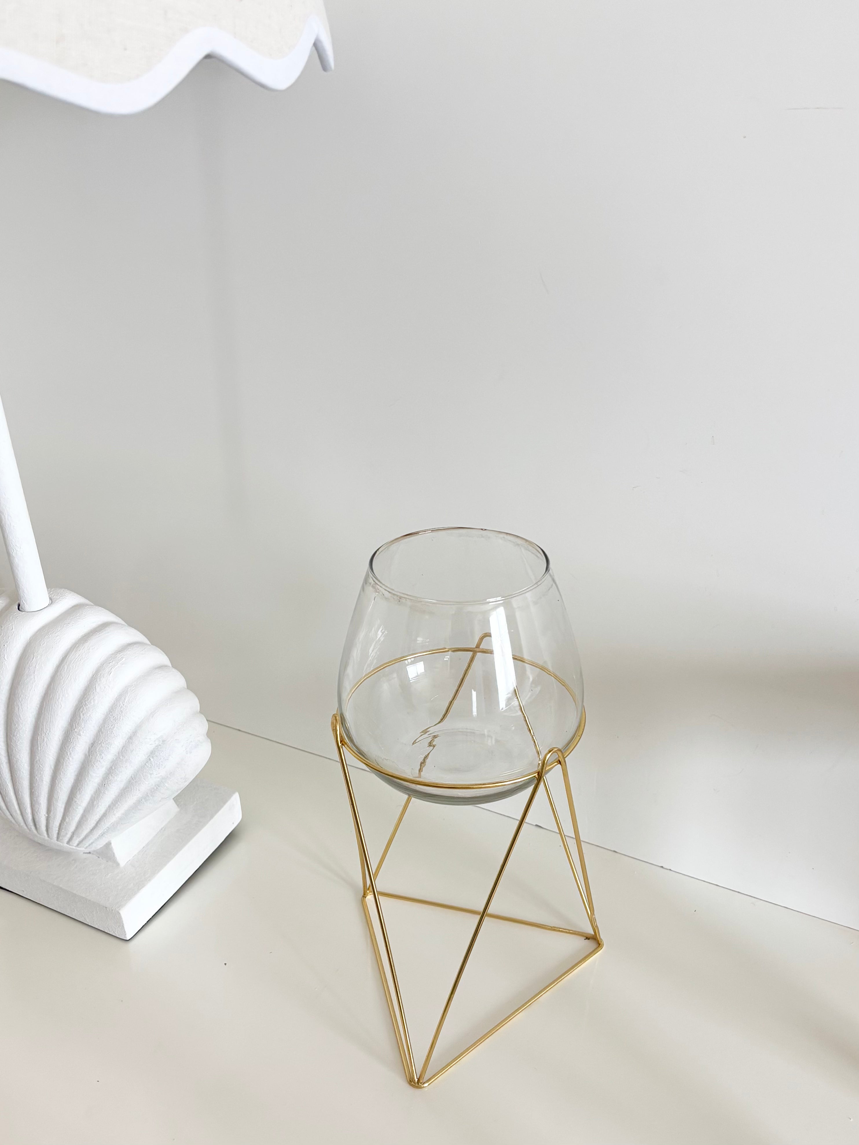 in bloom stand glass vase