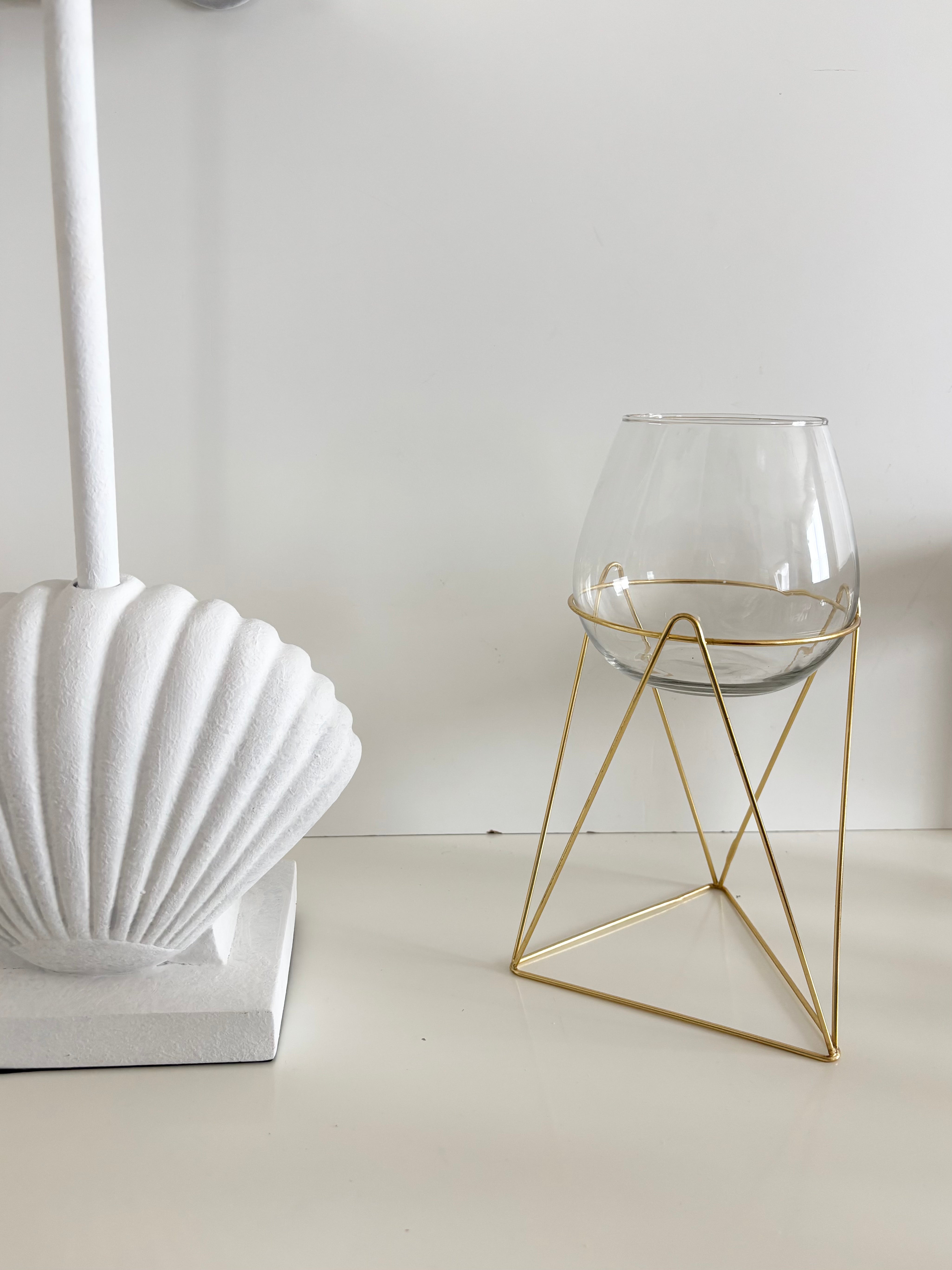 in bloom stand glass vase