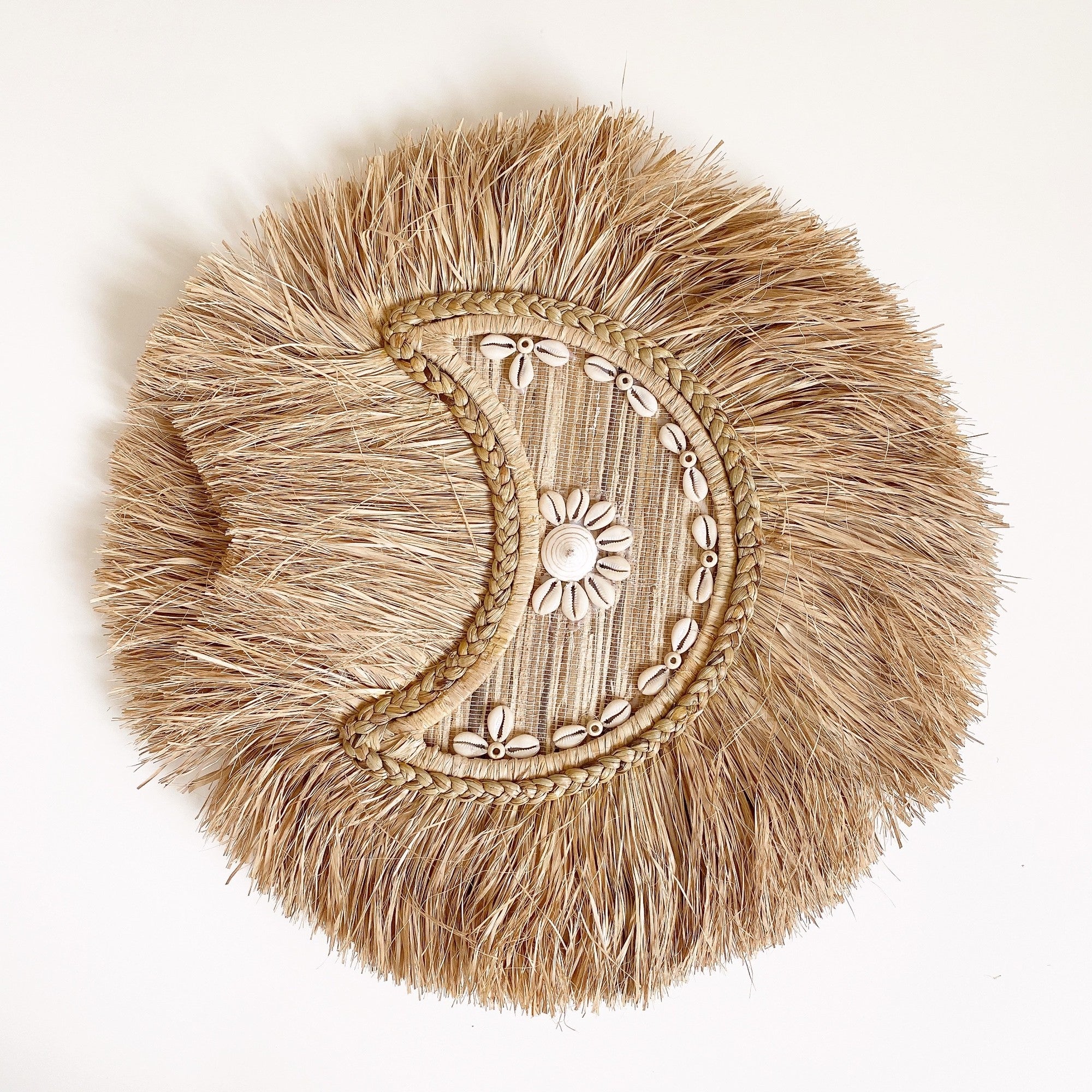 braided moon shell wall decor