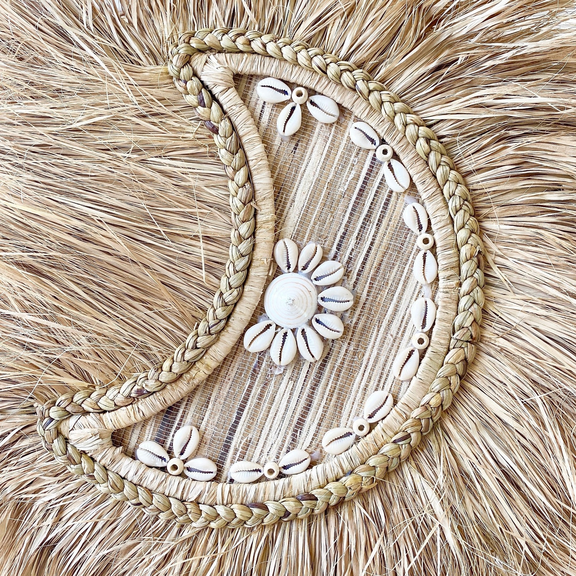 braided moon shell wall decor