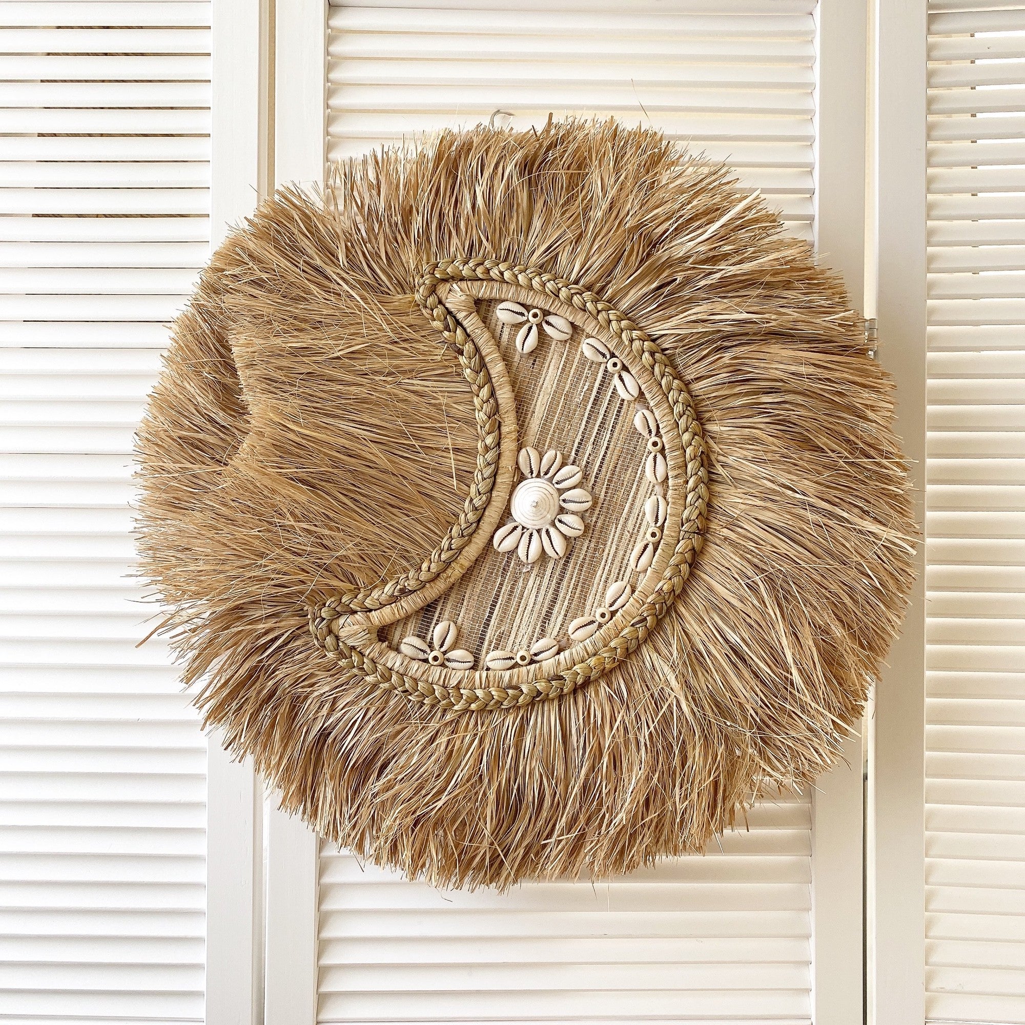 braided moon shell wall decor