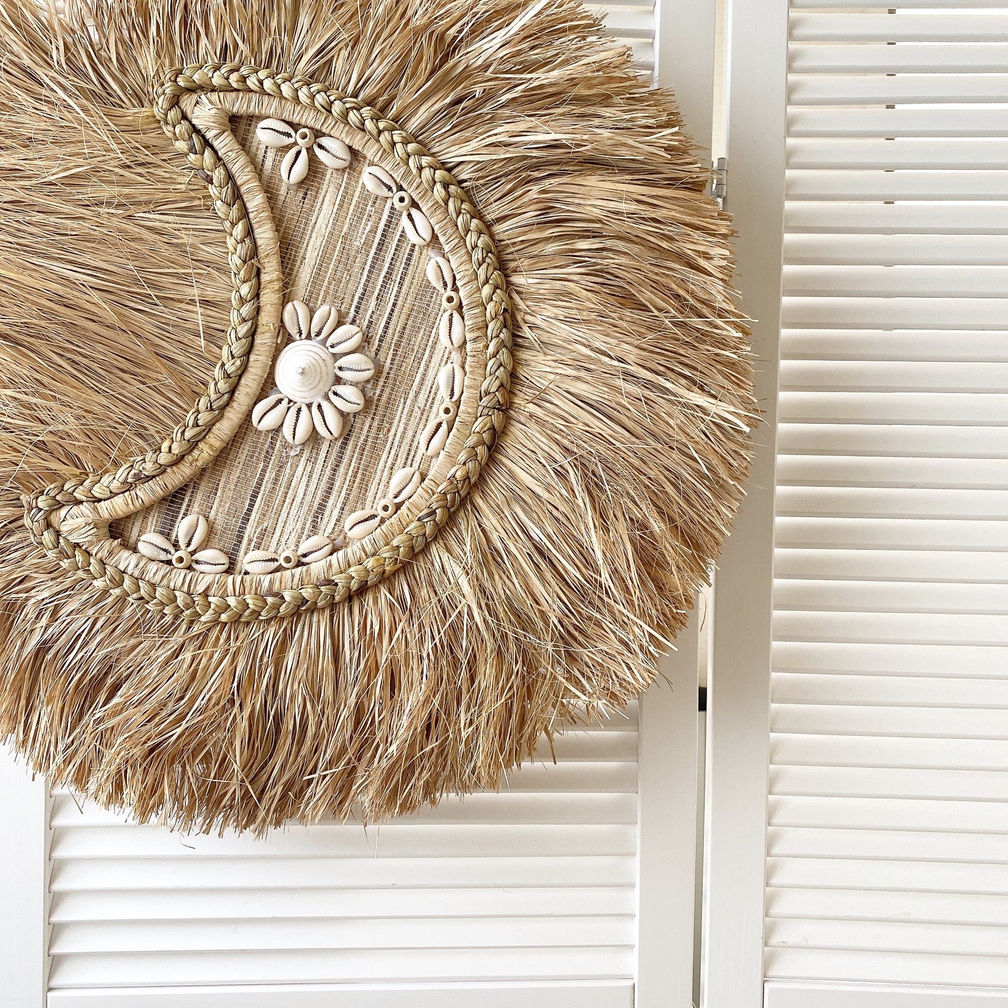 braided moon shell wall decor