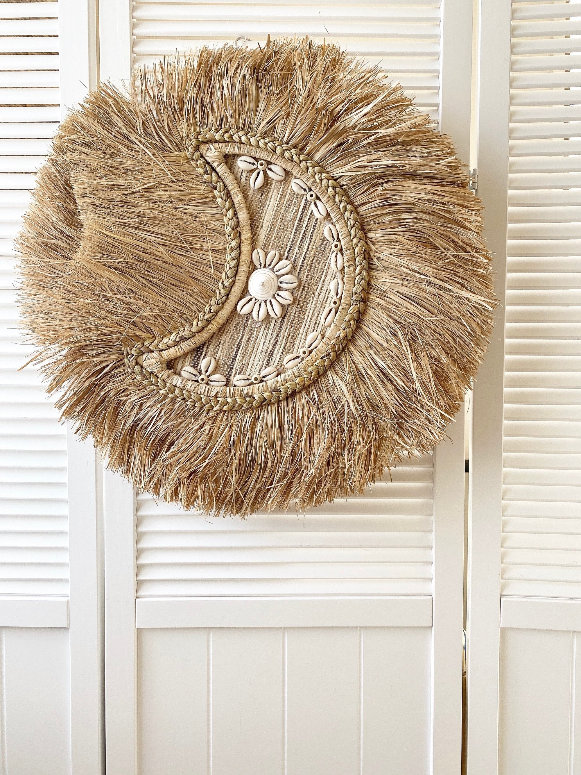 braided moon shell wall decor